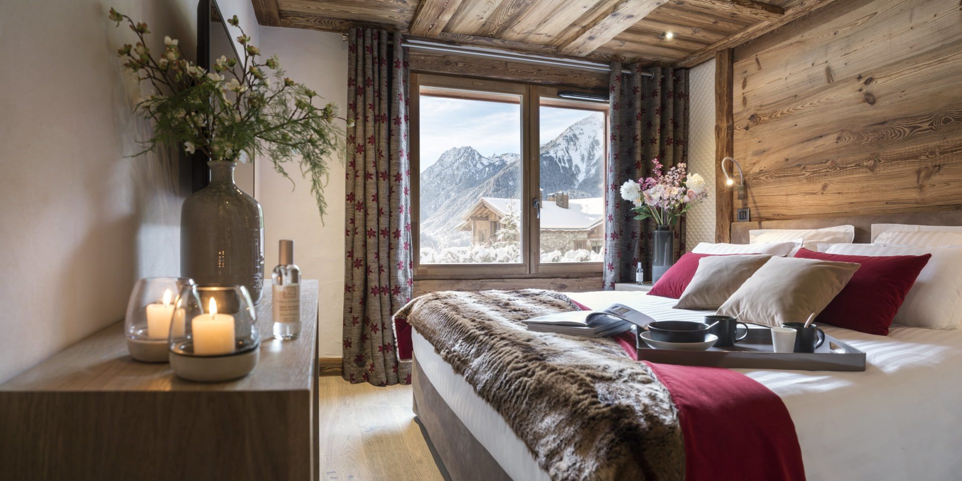 MGM Le Cristal de Jade Chamonix Mont Blanc Frankrijk wintersport skivakantie luxe slaapkamer kaarsen uitzicht berg comfortabel bed