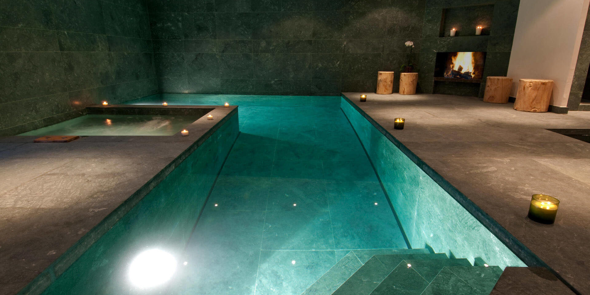 Chalet Nyumba Verbier Les 4 Vallees Zwitserland wintersport skivakantie luxe zwembad open haard kaarsen ontspannen relaxen genieten