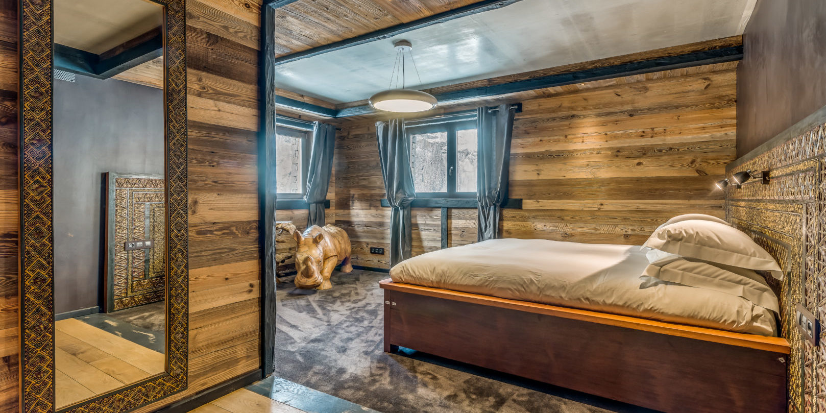 Chalet Ubud Tignes Les Brevieres Tignes-Val d'Isere Frankrijk wintersport skivakantie luxe slaapkamer 2-persoonsbed neushoorn